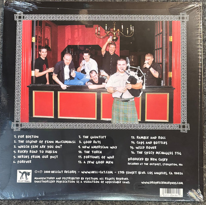 Back cover of Dropkick Murphys - Sing Loud, Sing Proud with a group photo and tracklist on a red and black background