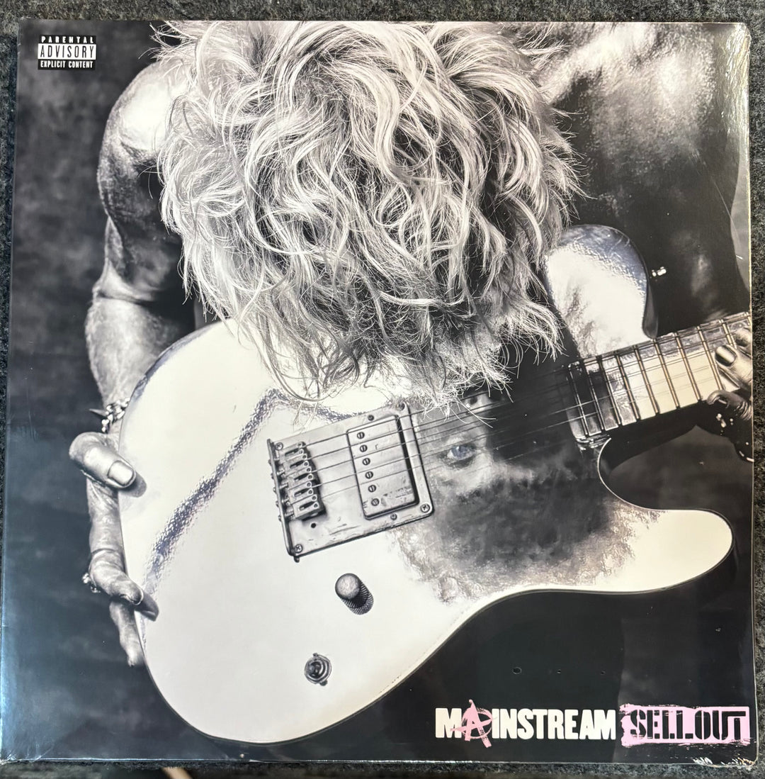 MACHINE GUN KELLY – MAINSTREAM SELLOUT cover with a person holding a guitar, featuring the text 'Mainstream Sellout'.