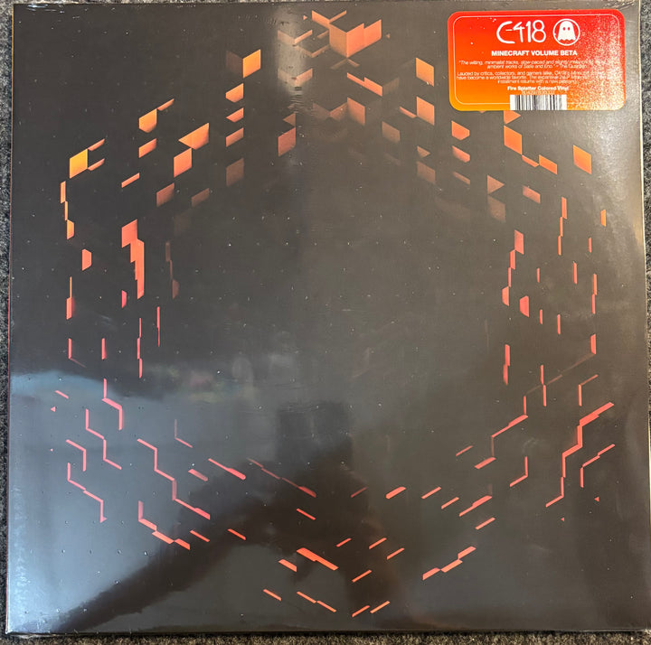 C418 - Minecraft Volume Beta vinyl record sleeve, featuring a black background with abstract orange geometric line patterns and a red-orange sticker in the top right corner.