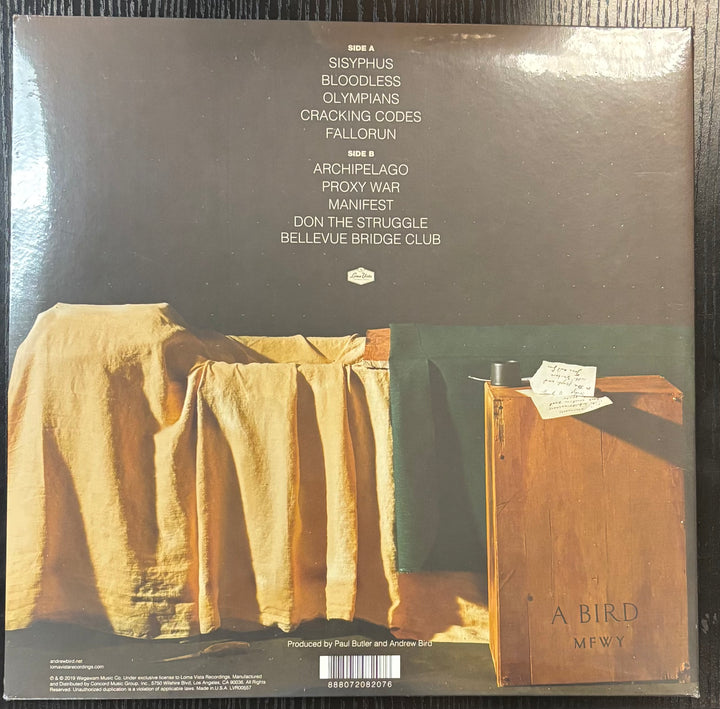 Andrew Bird Vinyl record cover with text and images of a draped cloth and wooden cabinet.
