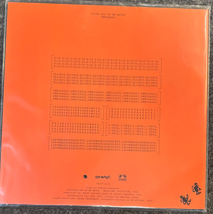 The back cover of Obrigaggi – Diles Que No Me Maten, featuring a bright orange background with extensive printed track listings, release text, and small black graphics, including a stylized rider logo in the bottom right corner.