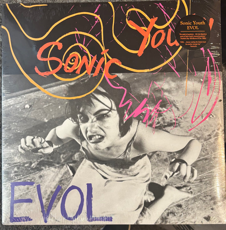 Vinyl record cover for Sonic Youth's 'Evol' with a person in a distressed pose.