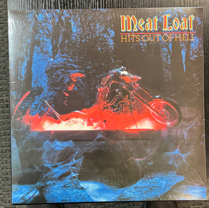 Album cover for 'Hits Out of Hell' by Meat Loaf featuring a motorcycle and fiery design.