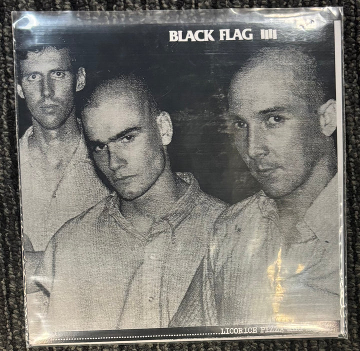 Album cover for Black Flag Licorice Pizza with three band members in black and white.