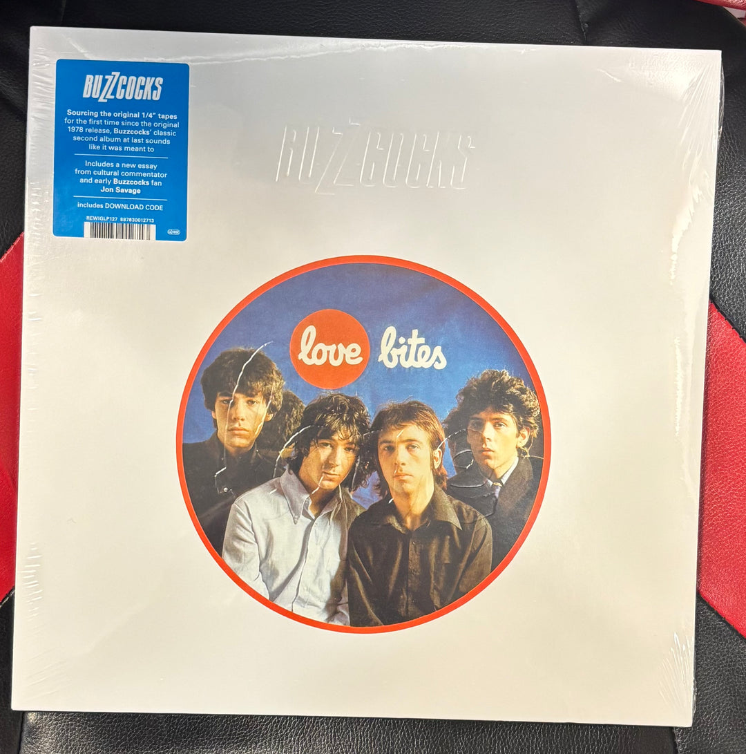 BUZZCOCKS - Love Bites Viny Vinyl record cover with a band photo and 'Buzzcocks' branding