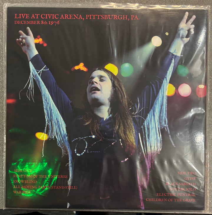 BLACK SABBATH - DAYS OF EVIL Album cover with a person with outstretched arms against a colorful light background, featuring text about a live concert at Civic Arena, Pittsburgh, PA.