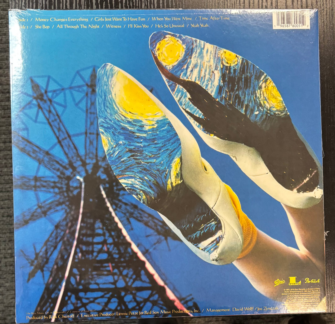 Cyndi Lauper - She's So Unusual record cover with artistic design of a Ferris wheel and hands holding a record