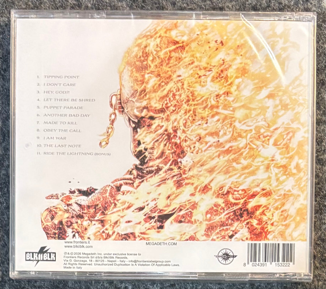 MEGADETH - MEGADETH CD case with fiery design and text on a textured surface
