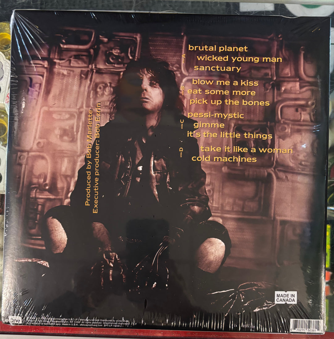 ALICE COOPER - Brutal Planet record cover with a person in a dark outfit and text on a spaceship interior background