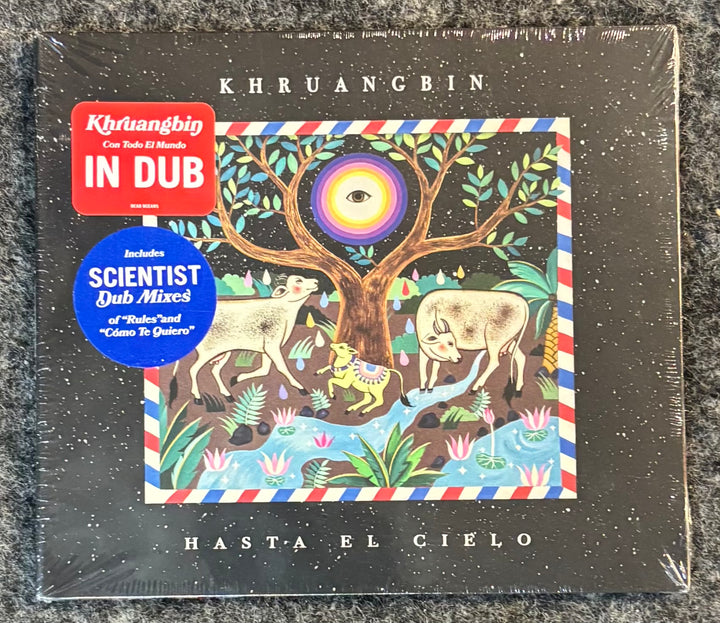 Album cover for 'Hasta El Cielo' by Khruangbin with colorful illustration and text.