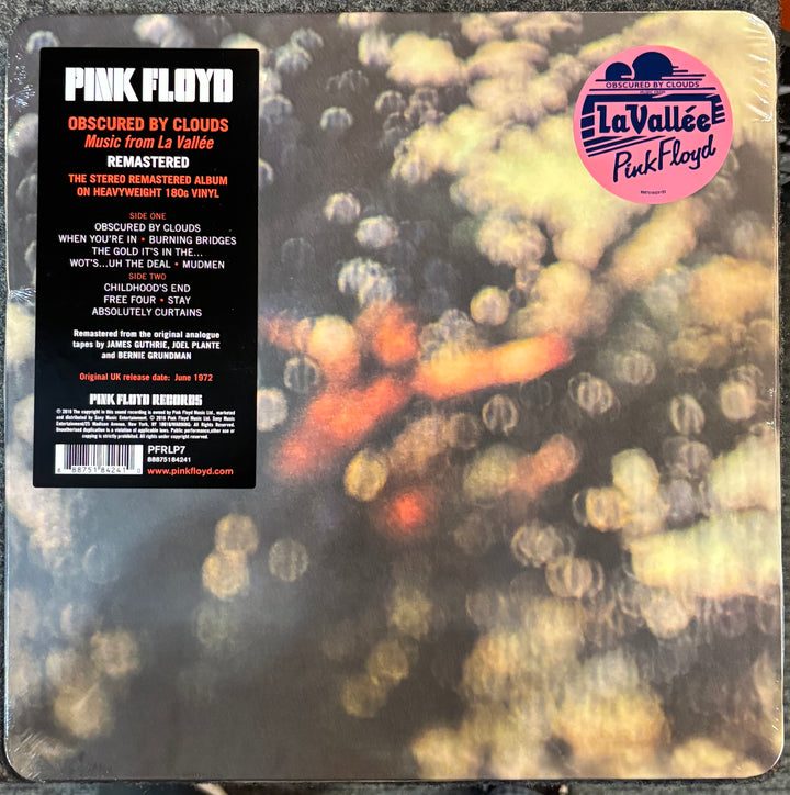 Pink Floyd – Obscured By Clouds record with 'Pink Floyd' album cover and blurred abstract design