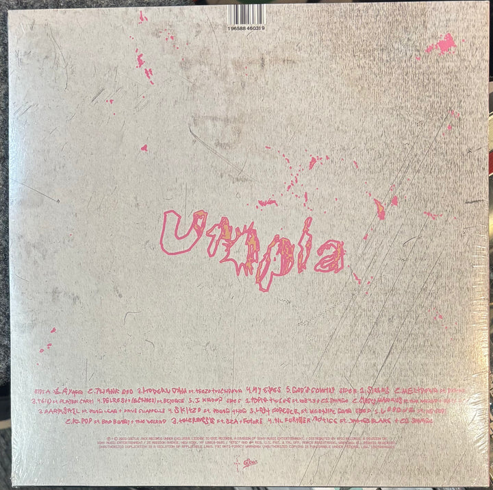 Travis Scott – Utopia cover with 'Utopia' in pink text on a textured beige background