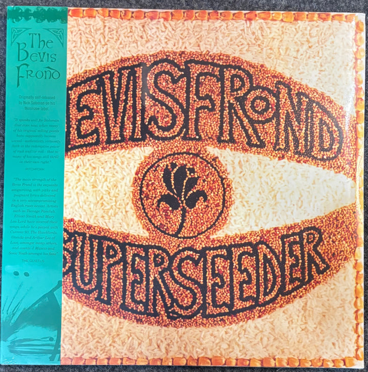 The front cover of The Bevis Frond - Superseeder vinyl record album, featuring a textured beige background with the title The Bevis Frond - Superseeder in stylized black lettering filled with orange-red dots, plus a turquoise vertical band on the left side.