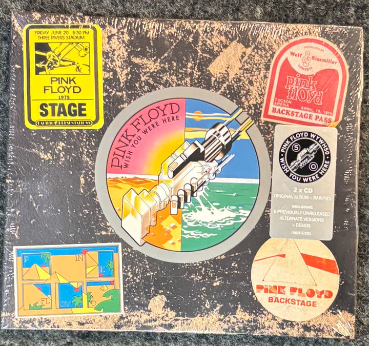Pink Floyd 'Wish You Were Here' album cover with various stickers and labels.