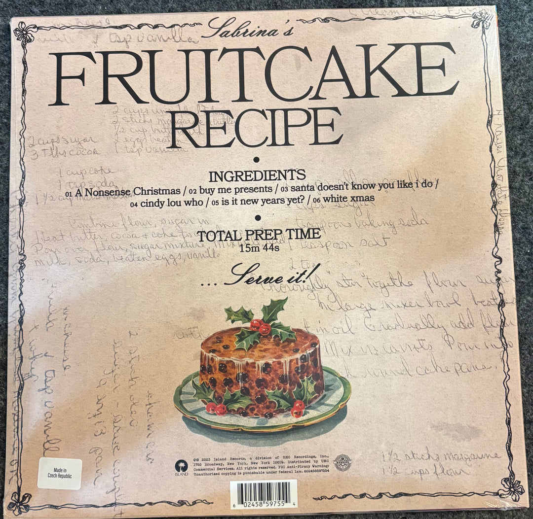 CARPENTER, SABRINA – FRUITCAKE (OLIVE GREEN VINYL) Fruitcake recipe card with a vintage design and illustration of a fruitcake.