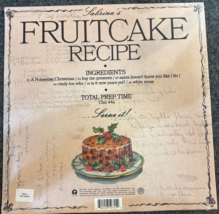 CARPENTER, SABRINA – FRUITCAKE (OLIVE GREEN VINYL) Fruitcake recipe card with a vintage design and illustration of a fruitcake.