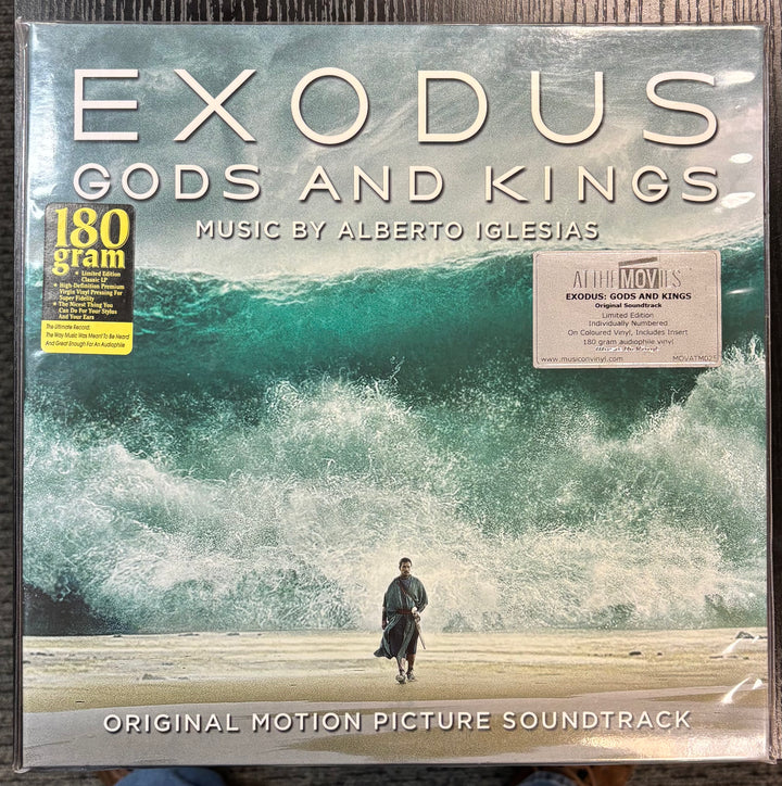 Vinyl album cover for 'Exodus: Gods and Kings' soundtrack with ocean and person walking scene.
