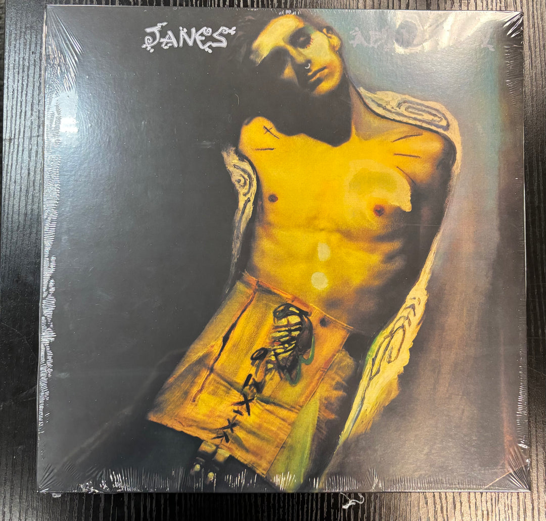 JANE'S ADDICTION record cover with a stylized illustration of a person with tattoos on a dark background.