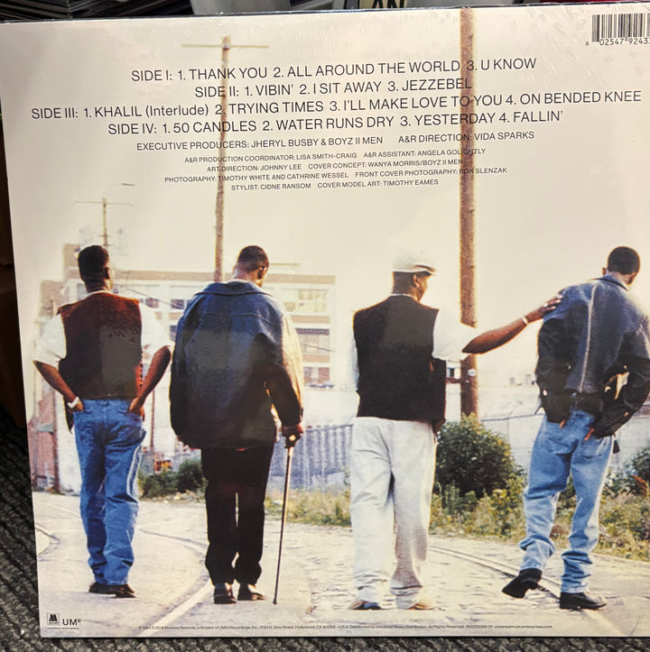 Back cover of BOYZ II MEN - II with four men walking on a street, featuring a list of track titles and credits.