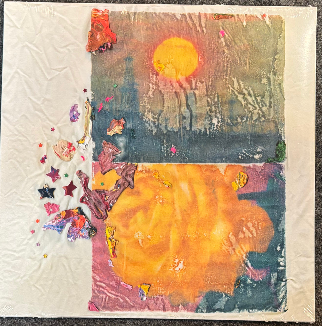 Burs – Significance, Otherness, featuring a large yellow sun over a dark blue and orange landscape with colorful star-like embellishments on the left, photographed on a dark textured surface.
