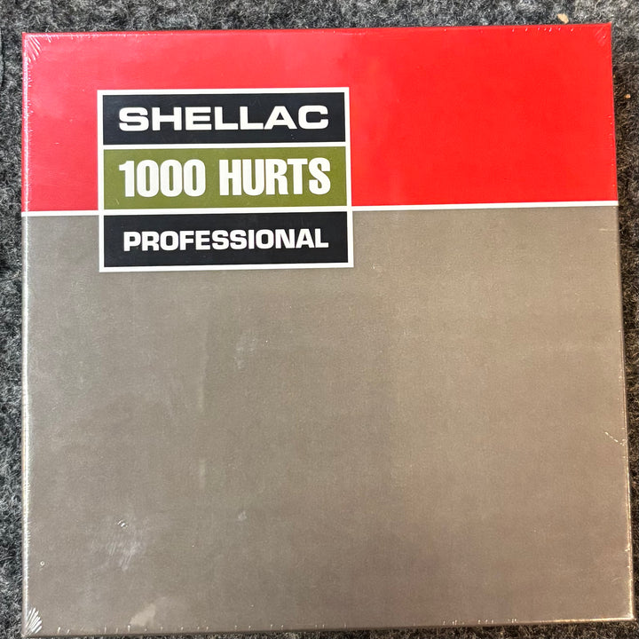  'Shellac 1000 Hurts Professional' CD label on a textured surface
