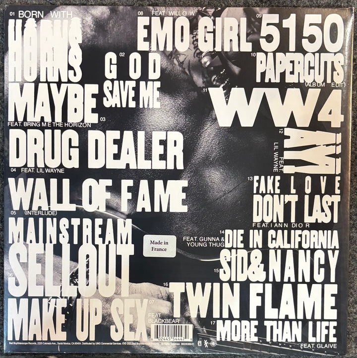 MACHINE GUN KELLY – MAINSTREAM SELLOUT record sleeve with text and a black and white image of a person.