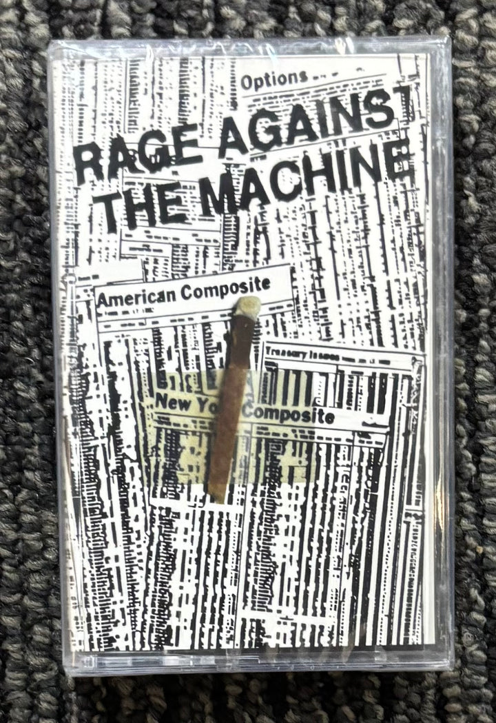 Cassette tape of '1991 demos' by Rage Against the Machine on a textured surface.