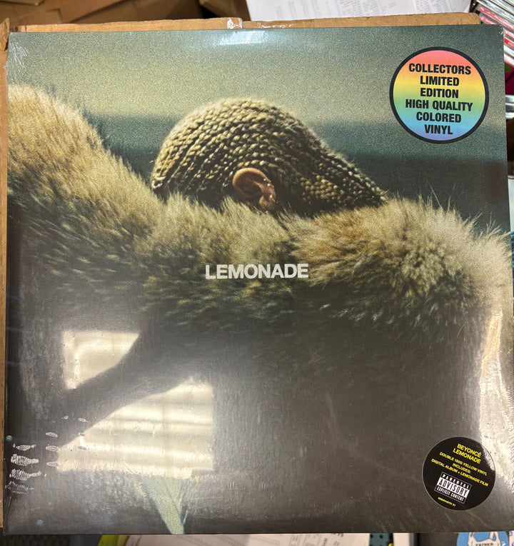 Beyoncé – Lemonade record cover with a close-up of a monkey's face and 'Lemonade' text, featuring a limited edition label.