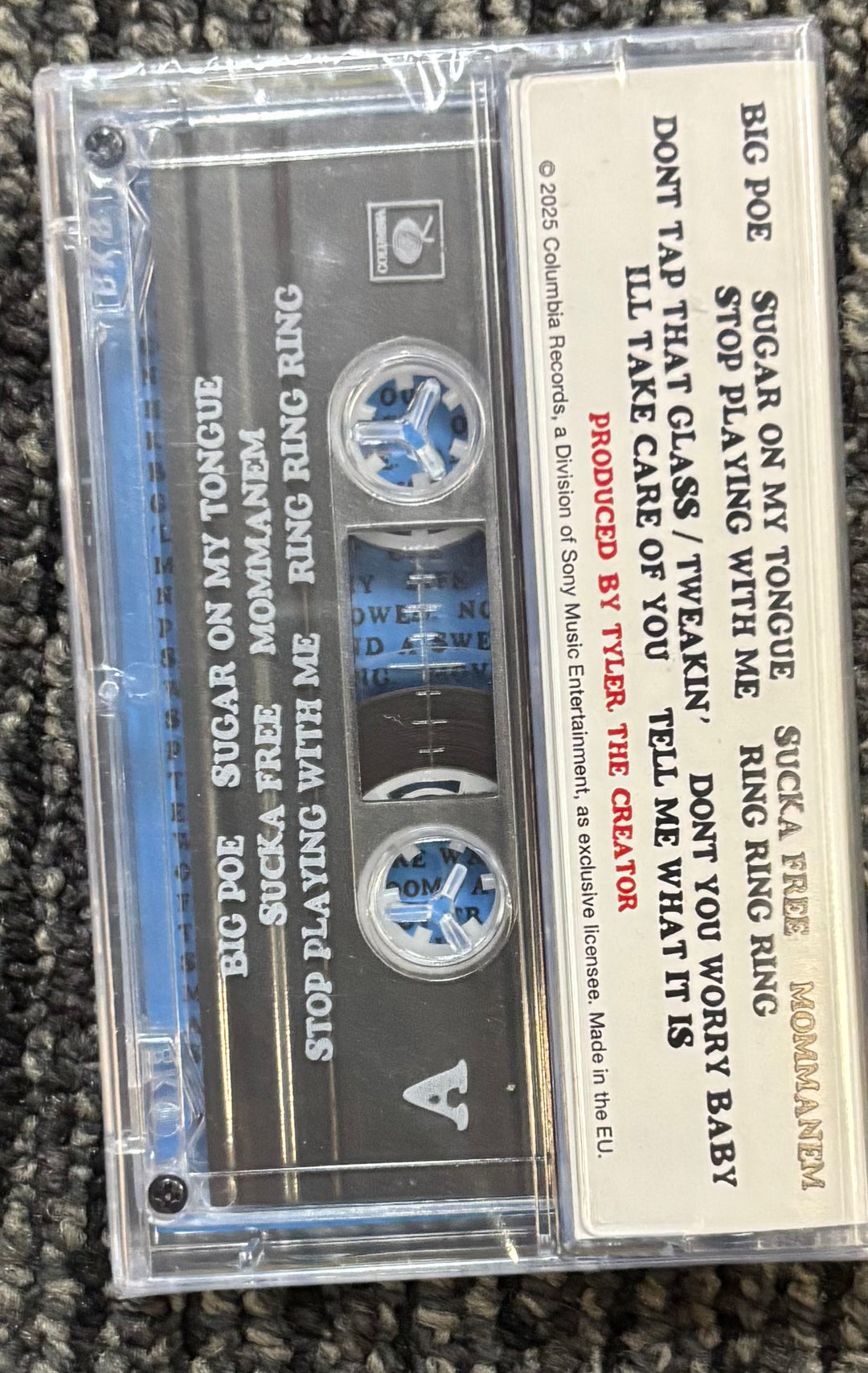 Tyler the creator Don't Tap the Glass Cassette tape with visible text on a textured surface