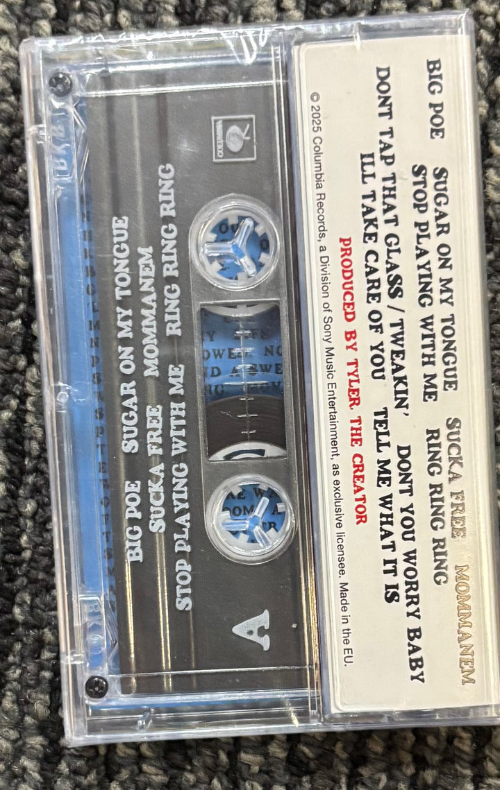 Tyler the creator Don't Tap the Glass Cassette tape with visible text on a textured surface