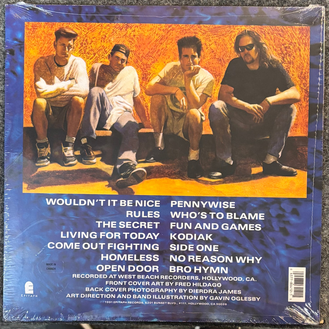 Back cover of PENNYWISE – PENNYWISE record with four men sitting on a bench and a list of song titles.
