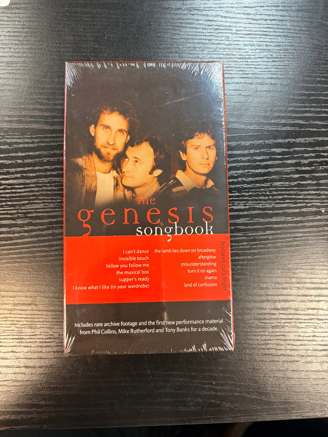 Cover of 'The Genesis Songbook' on a dark surface