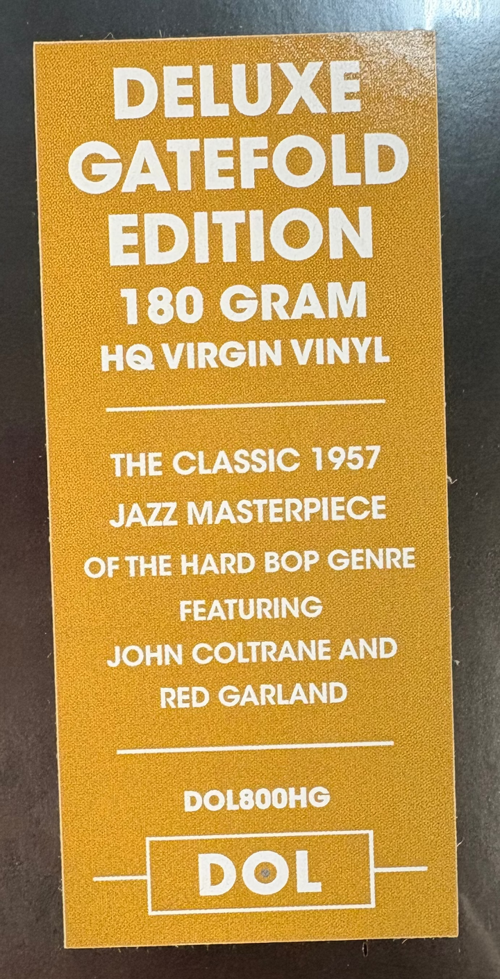 Deluxe gatefold edition vinyl record with orange label on black surface