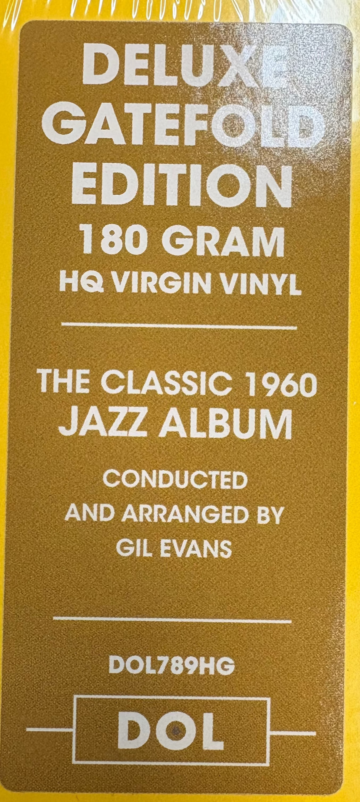 Yellow vinyl record cover with text about a deluxe gatefold edition vinyl album.
