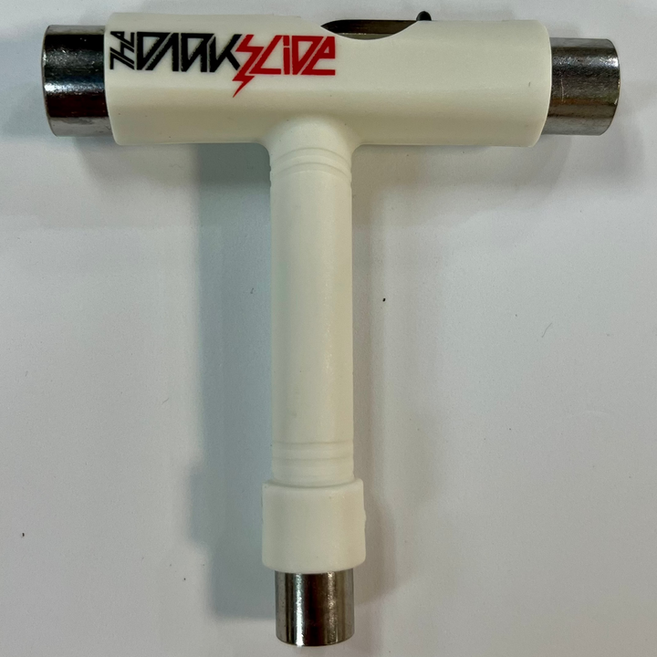 The Dark Slide "Lightning Logo" White T-shaped skateboard tool with sockets for different skateboard parts and Allen and Phillips wrenches. 