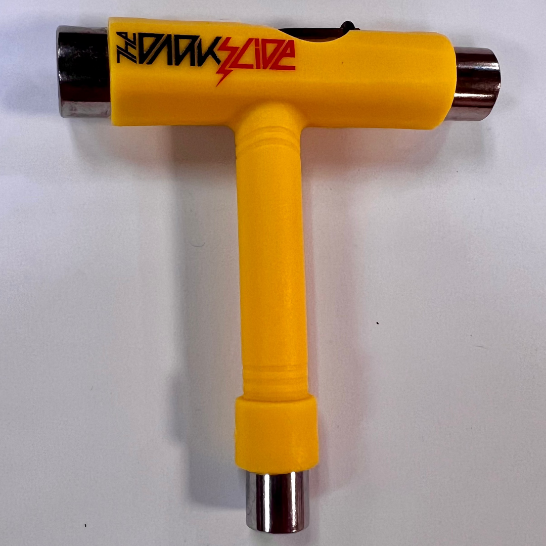The Dark Slide "Lightning Logo" Yellow T-shaped skateboard tool with sockets for different skateboard parts and Allen and Phillips wrenches. 