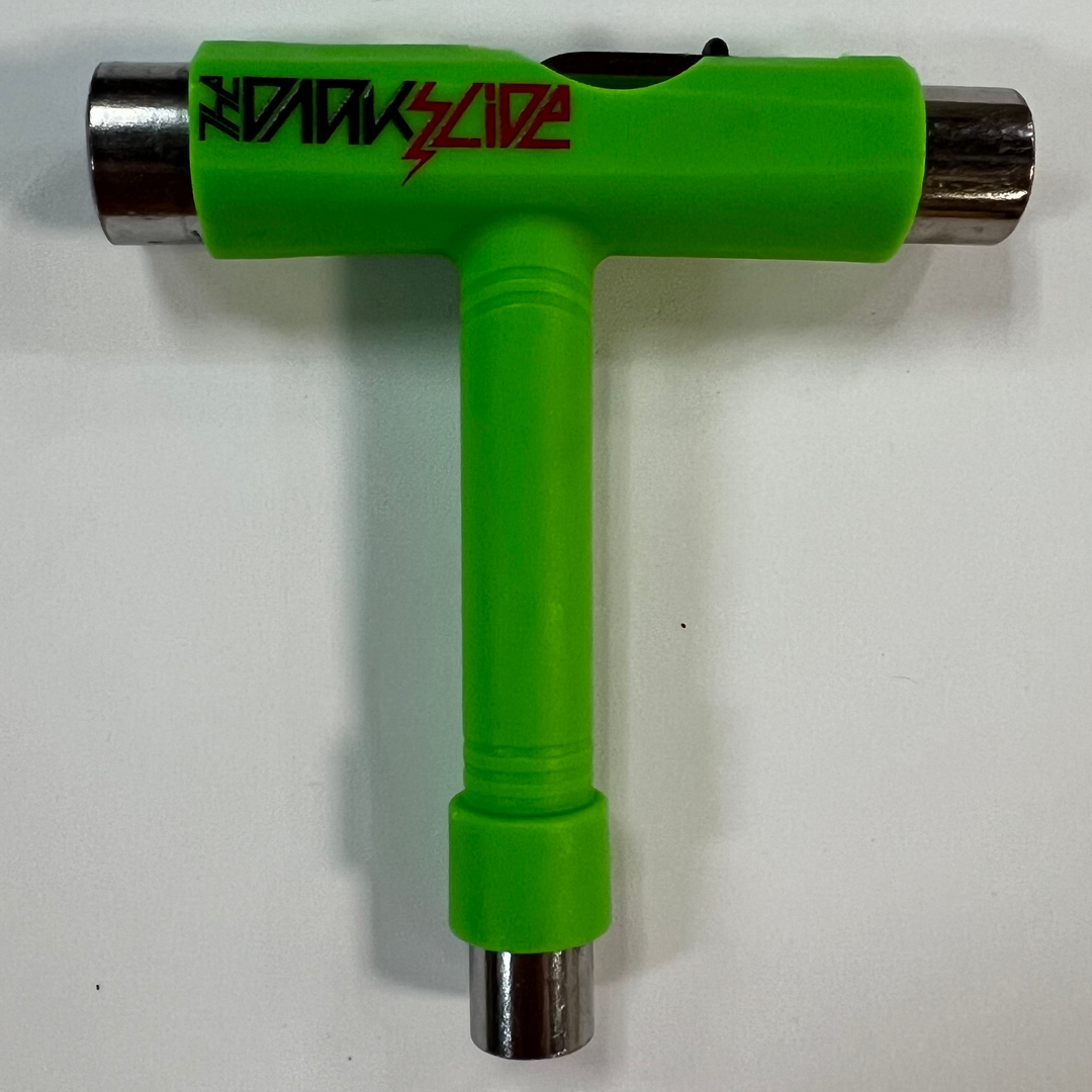 The Dark Slide "Lightning Logo" green T-shaped skateboard tool with sockets for different skateboard parts and Allen and Phillips wrenches. 