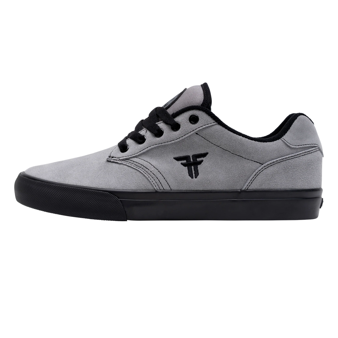 Gray sneaker with black accents on a white background