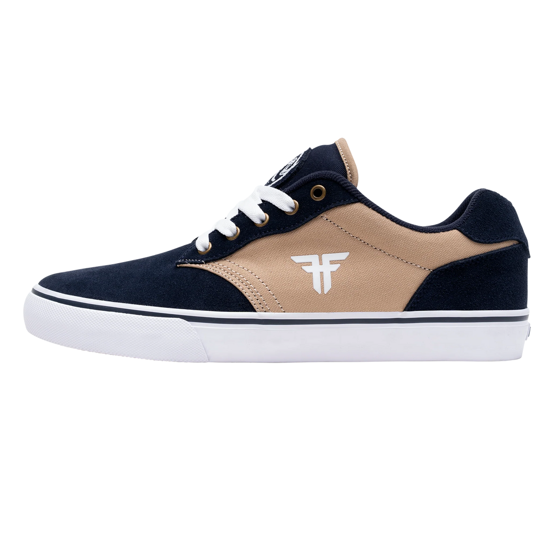 Navy and beige sneaker with white sole on a white background