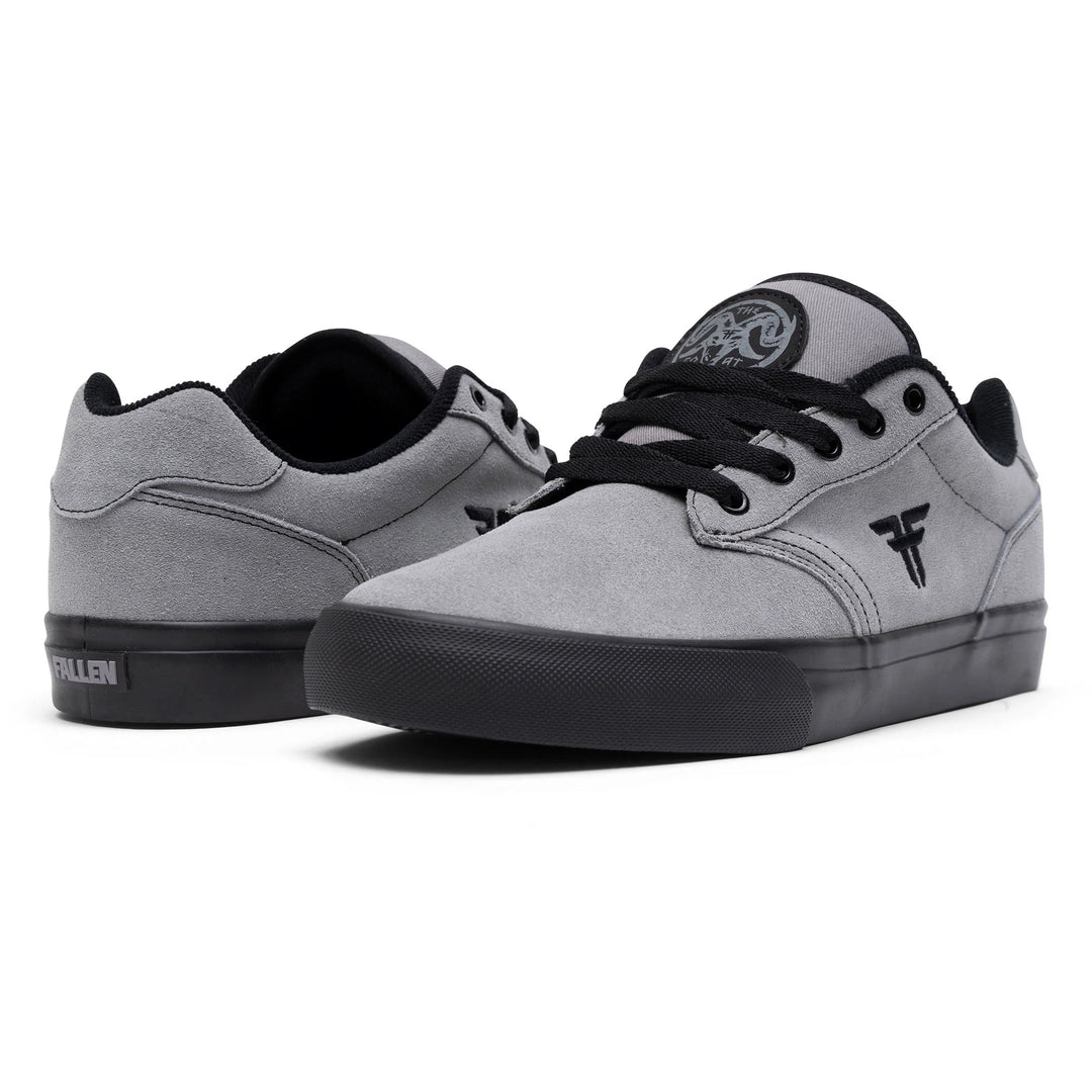 Gray sneakers with black soles on a white background