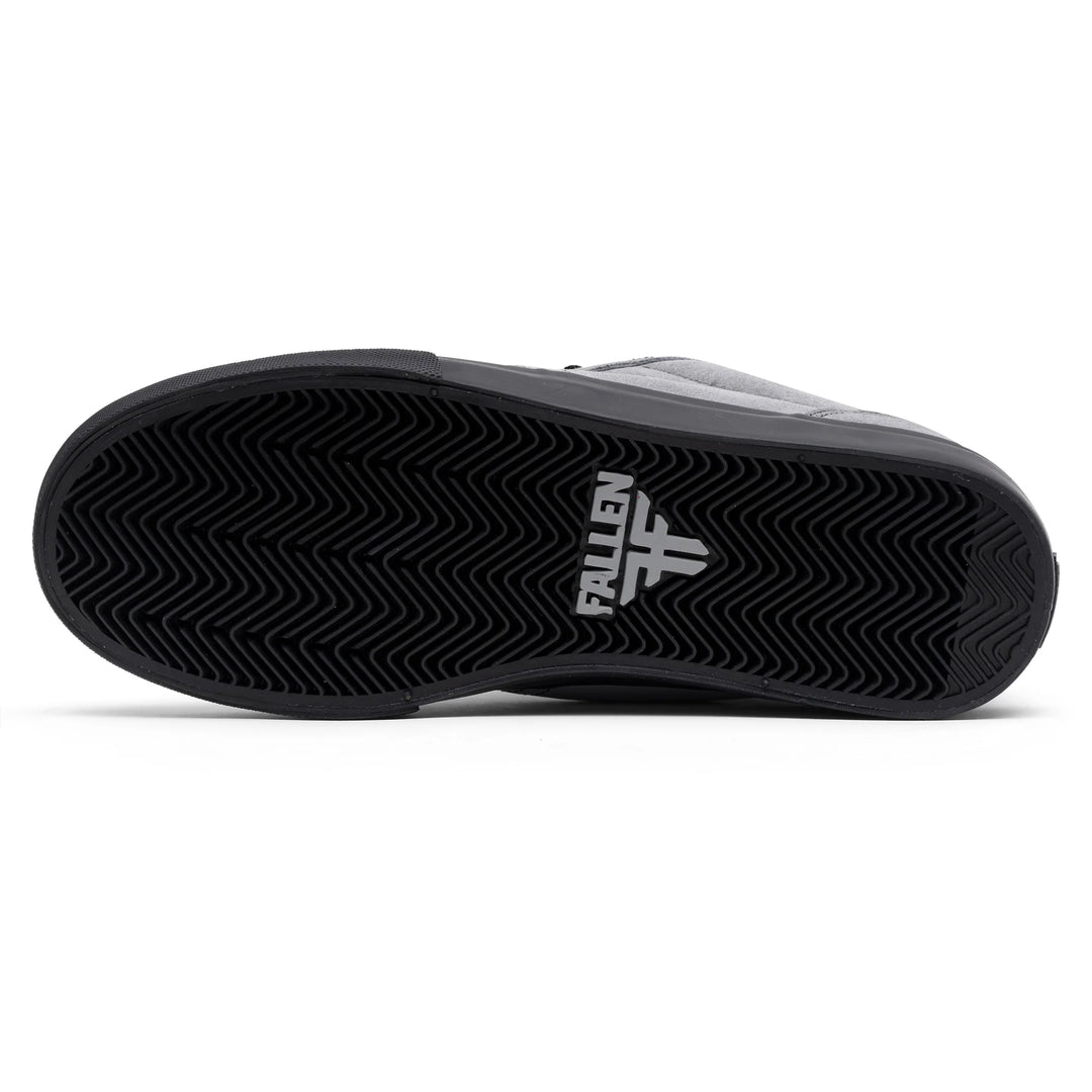 Black sneaker with 'Fallen' logo on a white background