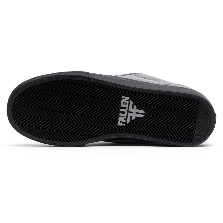 Black sneaker with 'Fallen' logo on a white background