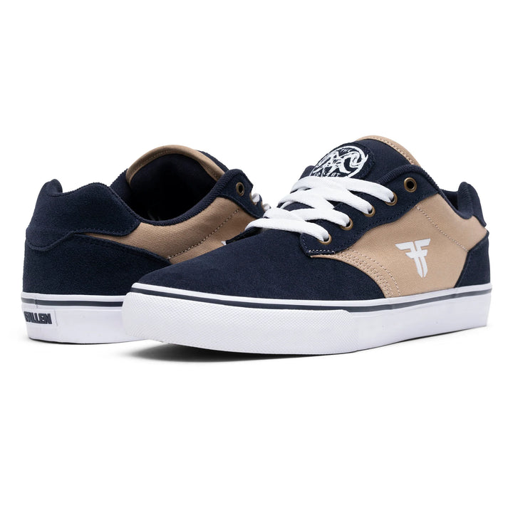 Navy and beige sneakers with white soles on a white background