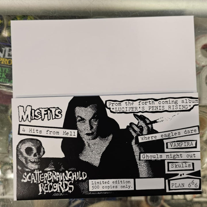 7" Vinyl Record of a women holding a skull text on a reflective surface.