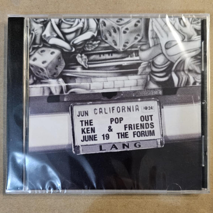 CD case with black and white design on a beige background