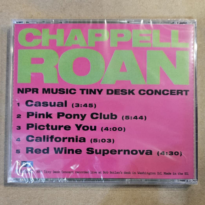 CD cover with pink and green text on a beige background