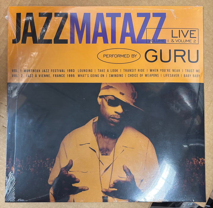 Vinyl record cover for 'Jazz Matazz Live Volume 2' performed by Guru with a person in a yellow shirt and hat.