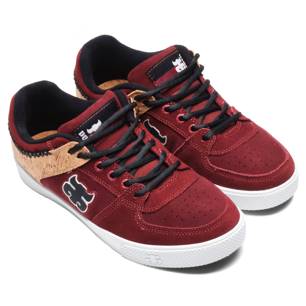Front three-quarter view of a pair of iPath Reed Low wine suede and cork shoes with black laces and white soles.