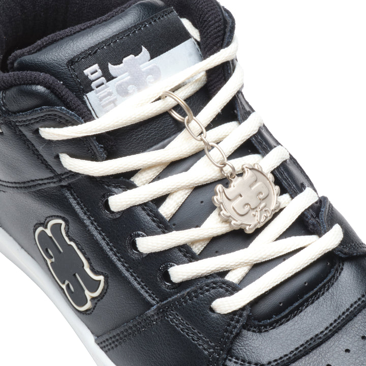Close-up of the iPath Reed Mid black leather shoe, showing the tongue label, cream laces and metal logo keychain.