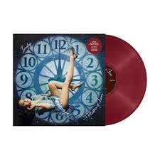 Laufey -A Matter Of Time record with a cover featuring a clock design and a person, on a black background.